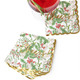 Woodland berry print beverage napkin with a gold 'Cheers!' script and scalloped gold edge (close-up view)