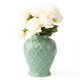 Large glossy sage-green ginger jar with raised geometric texture, styled with white roses (styled detail view)