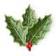 Glossy green ceramic dessert plate shaped like a holly leaf with a red berry cluster accent (close-up view)
