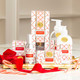 Peppermint Candy Cane foaming hand soap pump bottle with a red and gold lattice print (close-up view)