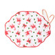 Holly Jolly Bows reversible placemat with a scalloped red edge and pink and red bow print (styled detail view)