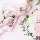 Sugarplum Gingham scalloped dinner napkin with a pink gingham nutcracker print (alternate angle)