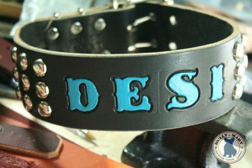 Shown here on black leather, nickle hardware, and turquoise Large Block Stamped text.