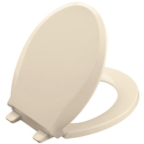 KOHLER Cachet Quiet-Close Round Closed Front Toilet Seat with Grip-Tight Bumpers in Almond