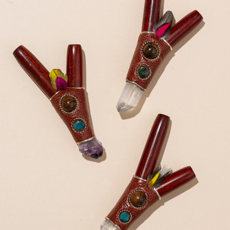 Rosewood and crystal kuripe applicators displayed together for ceremonial hapé use