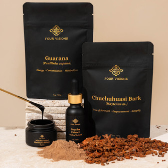 Vitality toolkit with guarana powder, chuchuhuasi bark, copaiba extract, and shilajit on beige background