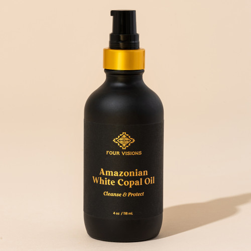Amazonian white copal oil in black pump bottle with gold lettering