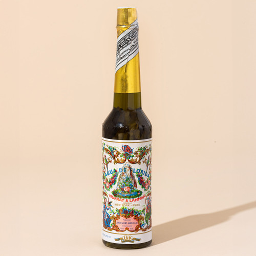 Traditional healing lotion agua de florida in bottle on beige background