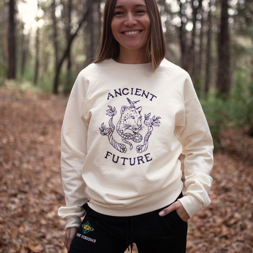 Woman wearing organic fleece crewneck in forest setting