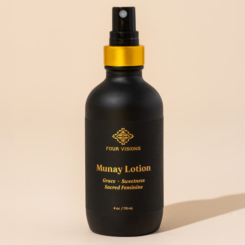 Munay healing lotion in black bottle on beige background