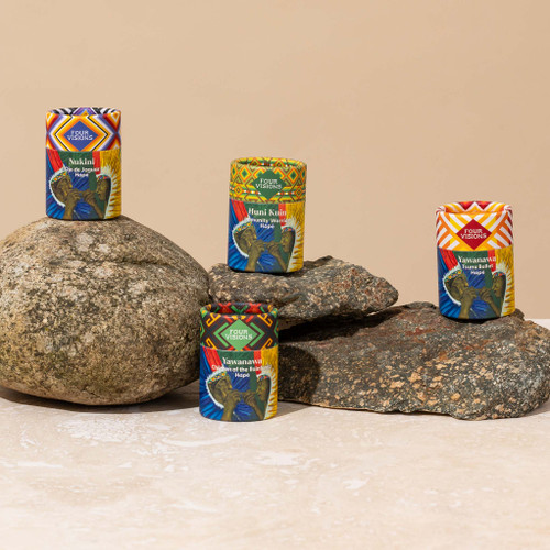 Sacred Masculine Hapé Bundle jars displayed on natural rocks