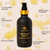 Sejé hair oil pump bottle on beige background with liquid oil drops and usage information