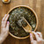 Healthy Cycles yoni steam herbal blend in bowl with scoop