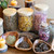 Fertility yoni steam herbs in glass jar with wooden bowl