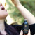 Woman using Suma Causay tincture with dropper