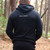Man walking away wearing organic fleece hoodie