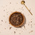 Chondur root in wooden bowl with metal spoon on beige background