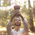 Man holding copalera incense burner in forest with sunlight