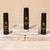 Anointing oil bundle with sweetgrass, coquindo, and palo santo oils on white rocks on beige background