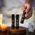 Anointing oil bundle with sweetgrass, coquindo, and palo santo oils on wooden surface