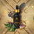 King nettle ortiga tincture bottle collage with feather, jaguar, ortiga leaf, and crystal
