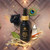 Caboclo Sananga eyedrops bottle with collage featuring panther, peacock feather, and crystal imagery