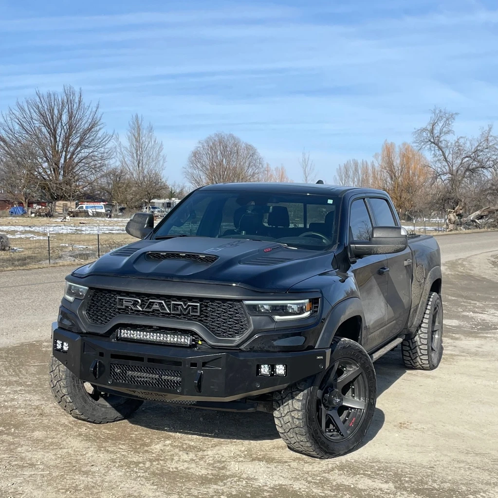 Dual Rigid Industries Dually's for fog lights. 
20" Rigid Industries RDS on top of the bumper. 
Parking sensor and side marker lights provisions. 
Clevis Mounts.