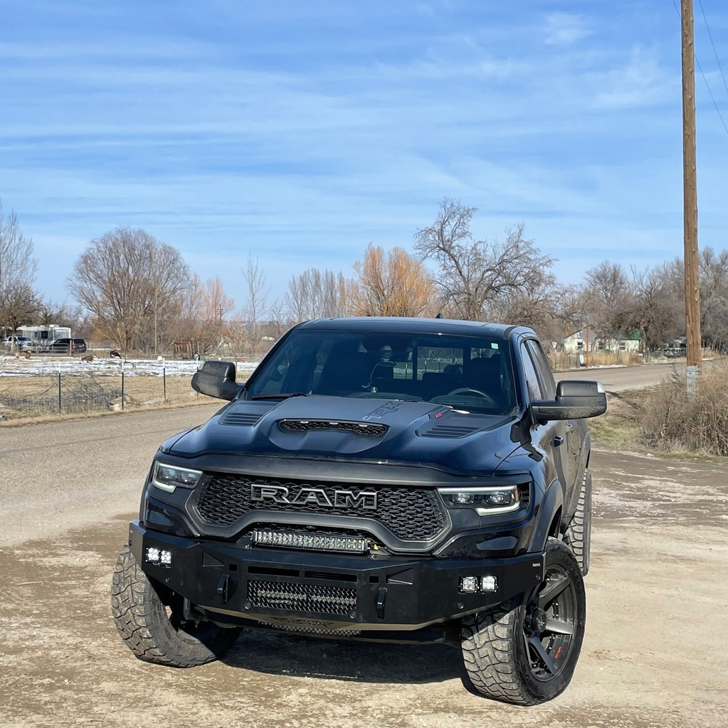 Dual Rigid Industries Dually's for fog lights. 
20" Rigid Industries RDS on top of the bumper. 
Parking sensor and side marker lights provisions. 
Clevis Mounts.