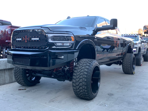 6" Rigid E-Series as fog lights. 
Hole/mounts for a 20" single row LED over the vent. 
Parking sensors.
Center vent with stainless steel mesh insert 