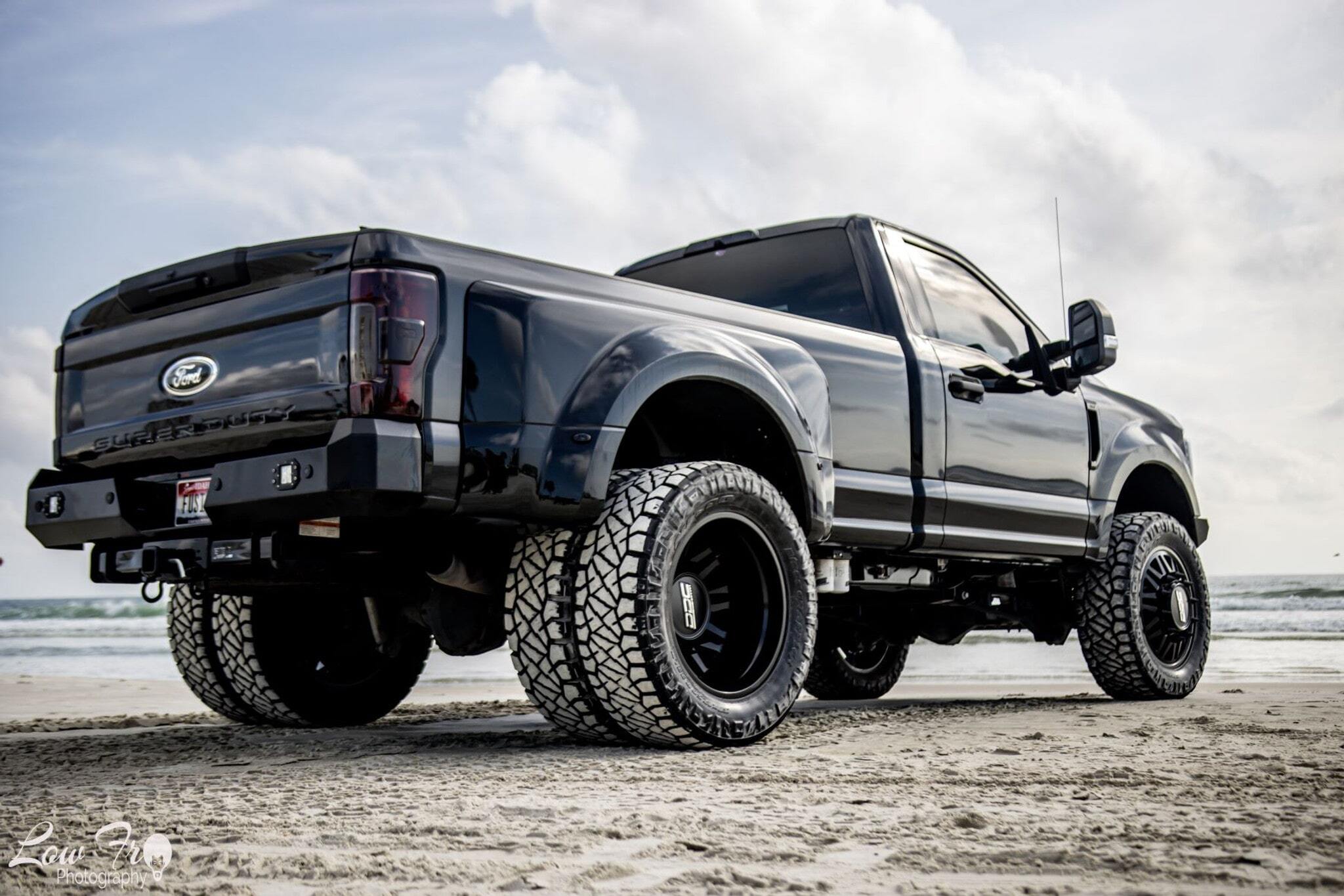 <p>DDC 22" Aftermath/ Nitto Ridge Grapplers. Project X Rear bumper with OLB flush mount lights.</p>