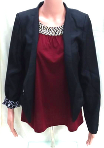 Black jacket with white patterned cuffs.