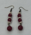 Maroon & White jade earrings designed by Carol Su.

2 1/4" in length with brass fish hook

Handmade in Texas.