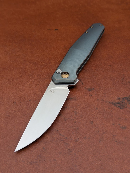 The Anso TOKO with Cuprum coloured anodised Titanium scales and bronze anodised accents.