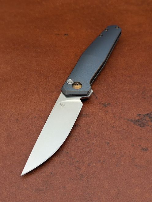 The Anso TOKO with Kobolt coloured anodised Titanium scales and bronze anodised accents.