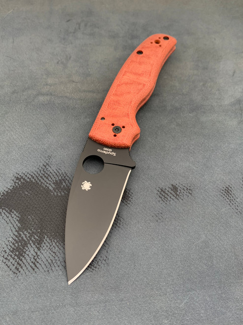 The Spyderco SHAMAN® JB Outman Exclusive with orange micarta scales and a DLC M390 blade