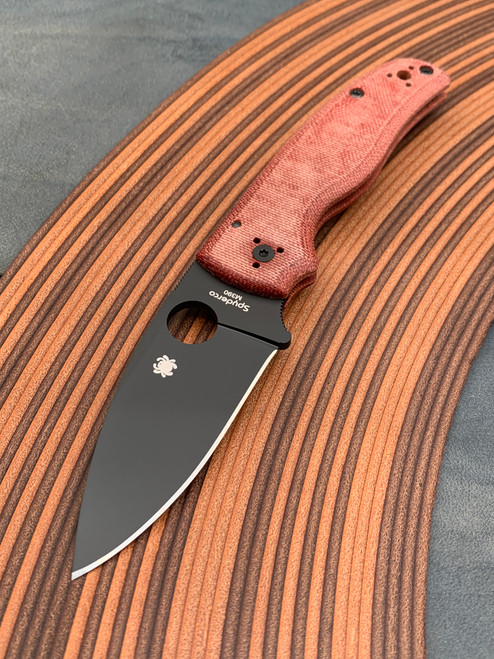 The Spyderco SHAMAN® JB Outman Exclusive with orange micarta scales and a DLC M390 blade