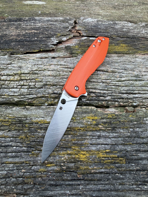 The Spyderco Positron Knife Center Exclusive in orange polished G10 with an S35VN blade.