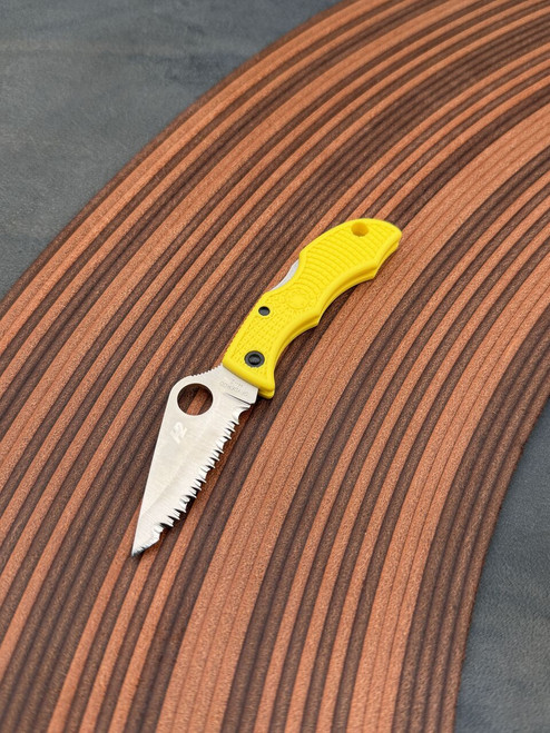 The Spyderco LadyBug 3 Salt with serrated blade in H2 steel and yellow FRN handle scales.