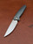 The Anso TOKO with Cuprum coloured anodised Titanium scales and satin finished accents.