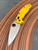 The Spyderco Manix 2 Lightweight Salt with Magnacut blade and yellow FRCP scales.