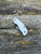 The Spyderco Urban GP Knives Exclusve with white FRN scales and PVD coated REX45 blade.