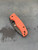 The Spyderco SHAMAN® JB Outman Exclusive with orange micarta scales and a DLC M390 blade