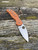 The Spyderco Sage 5 in REX 121 steel and  burnt orange coloured G10 handle scales.