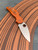 The Spyderco Sage 5 in REX 121 steel and  burnt orange coloured FRN handle scales.