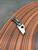 The Spyderco McBee with CTS-XHP blade steel and titanium framelock handle scales.
