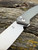 The Anso of Denmark TOKO with Cuprum anodised titanium scales.