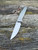 The Anso of Denmark TOKO with Cuprum anodised titanium scales.