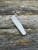 The Anso of Denmark TOKO with Cuprum anodised titanium scales.