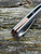The Anso TOKO with satin finished titanium scales and solid bronze backspacer.