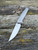 The Anso TOKO with satin finished titanium scales and solid bronze backspacer.